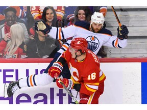 Flames defenceman Nikita Zadorov takes then-Oilers forward Zack Kassian into the boards during a game at Scotiabank Saddledome in this photo from May 18.
