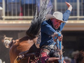 Ben Andersen, from Rocky Mountain House, rides Bright Lights to a score of 86.5 in Wednesday's saddle-bronc action at the Calgary Stampede rodeo.