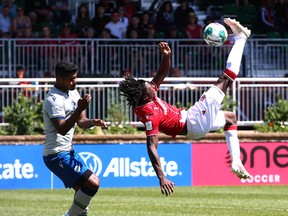 Cavalry Aribim People (R) makes a bicycle kick during CPL soccer action between Cavalry FC and Halifax Wanderers FC in Calgary at ATCO Field at Spruce Meadows Saturday, June 11, 2022. Pepple scored the lone goal in a 1-0 victory for the Cavs, but not on this play. Jim Wells/Postmedia