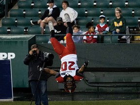 The Calgary Stampeders’ Peyton Logan celebrates with a back flip after scoring a touchdown against the Edmonton Elks dat Commonwealth Stadium in Edmonton on Thursday, July 7, 2022.