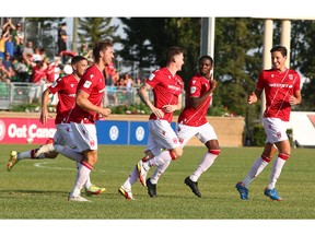 Cavalry players celebrate Joe Mason's goal a minute int the game during CPL soccer action between Forge FC and Cavalry FC at ATCO Field at Spruce Meadows in Calgary on Wednesday, July 27, 2022. Jim Wells/Postmedia