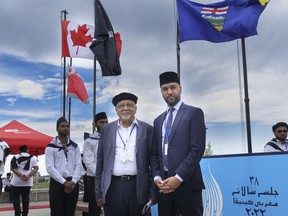 Sultan Mahmoud, a representative of the Ahmadiyya Muslims of Calgary, and Zaki Ahmad pose for a photo at the 38th annual Jalsa Salana Muslim convention in Calgary on Saturday, July 30, 2022.