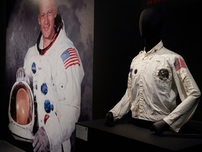 In this file photo taken on July 21, 2022, Buzz Aldrin's Inflight Coverall Jacket, worn on his Apollo 11 mission to the Moon, is displayed during a media preview at Sothebys in New York.