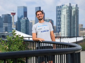 German cyclist Darius Braun was photographed with the Calgary skyline in the background on Monday, July 25, 2022. Braunon overcame paralysis due to a brain tumour surgery and is planning to cycle 20,000 km from Calgary to Ushuaia, Argentina, to raise awareness and funds for brain tumour research. However, on the flights to Calgary, his luggage with all of his trail supplies and bike was lost. He needs to either replace it all or wait for the luggage to be found.