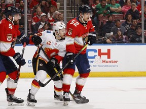 Then-Florida Panthers defenceman MacKenzie Weegar (right) defends against Calgary Flames forward Andrew Mangiapane at the BB&T Center in Sunrise, Fla., on March 1, 2020.