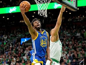 FILE PHOTO: Jun 16, 2022; Boston, Massachusetts, USA; Golden State Warriors forward Andrew Wiggins (22) shoots the ball against Boston Celtics forward Grant Williams (12) during the second quarter in game six of the 2022 NBA Finals at TD Garden.