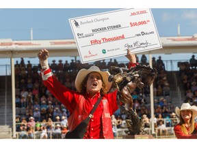 Rocker Steiner of Weatherford, Texas, won Bareback at the Calgary Stampede Rodeo in Calgary, Ab.,  on Sunday, July 17, 2022. Mike Drew/Postmedia