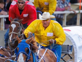 Cowboys Rangeland Derby driver Ross Knight charges to the finish in Heat 5 of the Rangeland Derby at the Calgary Stampede on Friday July 8, 2022.