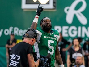 Saskatchewan Roughriders wide receiver Duke Williams (5) gestures to the sky after scoring a touchdown against the Ottawa Redblacks during first half of CFL football action in Regina, Friday, July 8, 2022.