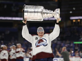 Colorado Avalanche defenceman Cale Makar (8) celebrates with the Stanley Cup after the game against the Tampa Bay Lightning in game six of the 2022 Stanley Cup Final at Amalie Arena. Mandatory Credit: Geoff Burke-USA TODAY Sports