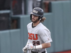 Oregon State outfielder Jacob Melton rounds third base after hitting a solo home run during the fourth inning of an NCAA college baseball tournament super regional game against Auburn on Sunday, June 12, 2022, in Corvallis, Ore.