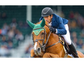 Rowan Willis, of Australia, riding Blue Movie during the CP International competition at the Spruce Meadows Masters in Calgary on Sunday, September 12, 2021. Al Charest / Postmedia