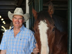 Chuckwagon driver Kirk Sutherland stands with his right leader horse Max in the barns at the Calgary Stampede on Monday, July 11, 2022.
Gavin Young/Postmedia