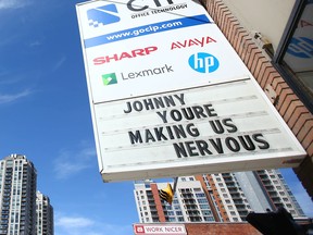 A sign on the front of CIP office technology in downtown Calgary shares an opinion on Tuesday afternoon.