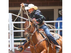 Haven Meged of Miles City, MT, posted a time (7.6 seconds) on Day 3 of the tie-down roping event at the Calgary Stampede rodeo on Sunday, July 10, 2022. Al Charest / Postmedia