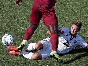 Roberto Alarcon -- then with FC Tucson -- tackles Red Wolves SC defender Uchenna Uzo during a USL League One soccer match in this photo from Aug. 1, 2020, in East Ridge, Tenn.