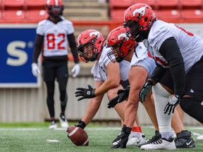 Calgary Stampeders offensive lineman Bryce Bell holds the ball during practice at McMahon Stadium on Wednesday, Aug. 3, 2022.