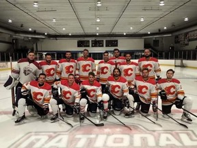Jonathan Huberdeau, back centre, and his summer league team in Montreal, all outfitted in the Flaming C. Huberdeau was traded to Calgary last month and just signed an eight-year, US$84-million contract extension with the Flames.