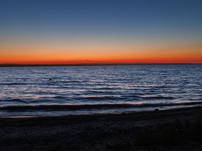 Sunset’s glow lights the horizon at McGregor Lake by Milo, Ab., on Monday, August 8, 2022.