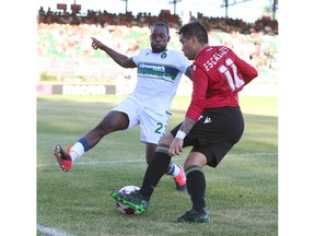 York Chrisnovic N'Sa defends against Jose Escalante during CPL soccer action between Cavalry FC and York United in Calgary at ATCO Field at Spruce Meadows on Tuesday, July 19, 2022. Jim Wells/Postmedia