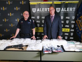 Calgary Police Supt. Scott Boyd (L) and CPS Staff Sgt. Shawn Wallace pose in Calgary at Calgary Police Headquarters on Thursday, August 11, 2022. Nearly $3 million dollars’ worth of methamphetamine and fentanyl were seized in a pair of ALERT investigations in Calgary. Two investigations by ALERT’s Calgary organized crime team, which both concluded just days apart, have yielded substantial seizures of fentanyl and methamphetamine. In addition to the drugs, ALERT seized four firearms and arrested five suspects.