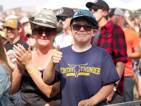 Fans give a thumbs-up for all the artists on Day 3 of the Country Thunder music festival at Fort Calgary on Sunday, August 21, 2022. Dean Pilling/Postmedia