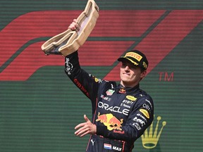 Red Bull Racing's Dutch driver Max Verstappen celebrates his victory during the podium ceremony of the Belgian Formula One Grand Prix at Spa-Francophones racetrack at Spa, on Aug. 28, 2022.