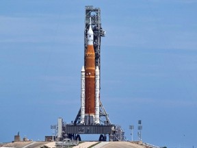 NASA's next-generation moon rocket, the Space Launch System, with the Orion crew capsule perched on top, stands on launch complex 39B one day after an engine-cooling problem forced NASA to delay the debut test launch at Cape Canaveral, Fla., Tuesday, Aug. 30, 2022.