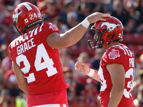 Stampeders kicker Rene Paredes celebrates with holder Cody Grace after making a field goal on Saturday.