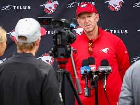 Calgary Stampeders head coach Dave Dickenson, pictured after practice on July 26, did not travel with the team to Ottawa on Thursday for a game against the Redblacks on Friday.