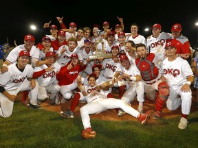 The Okotoks Dawgs celebrate after defeating the Moose Jaw Miller Express 4-1 to win the WCBL championship at Seaman Stadium in Okotoks on Thursday, Aug. 18, 2022.