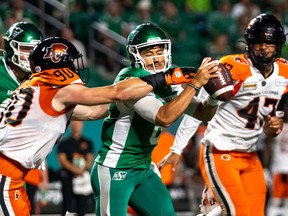 B.C. Lions defensive lineman Mathieu Betts tackles Saskatchewan Roughriders quarterback Mason Fine at Mosaic Stadium in Regina on Friday, July 29, 2022.