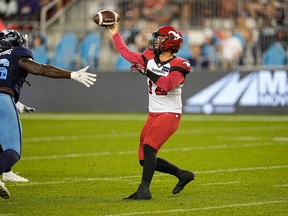 Calgary Stampeders quarterback Jake Maier passes against Toronto Argonauts defensive lineman Sam Acheampong at BMO Field in Toronto on Aug. 20, 2022.