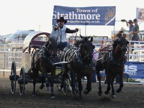 Kurt Bensmiller wins the eighth heat with his Versatile Energy Services Ltd. outfit during the Strathmore Stampede chuckwagon races on Sunday, July 31, 2022.