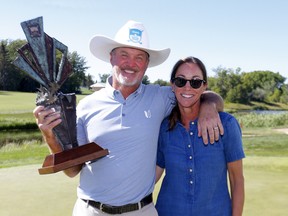 Jerry Kelly celebrates his Shaw Charity Classic victory with his wife Carol at Canyon Meadows Golf and Country Club in Calgary on Sunday, Aug. 7, 2022.