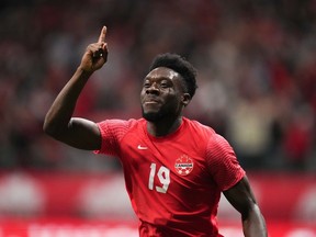 Canadian soccer star Alphonso Davies says he will donate his World Cup earnings to charity. Davies celebrates his penalty kick goal against Curacao during the first half of a CONCACAF Nations League soccer match, in Vancouver, on Thursday, June 9, 2022.