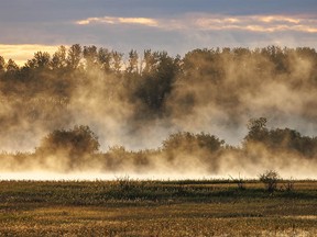 Morning mist at a lake east of Irricana, Ab., on Tuesday, September 6, 2022. Mike Drew/Postmedia