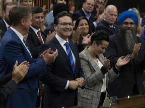 Conservative members applaud Conservative leader Pierre Poilievre as he rises for his first question in Question Period, Tuesday, September 20, 2022 in Ottawa.