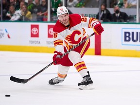 DALLAS, TX - MAY 13:  Michael Stone #26 of the Calgary Flames passes the puck against the Dallas Stars during the second period in Game Six of the First Round of the 2022 Stanley Cup Playoffs at American Airlines Center on May 13, 2022 in Dallas, Texas.