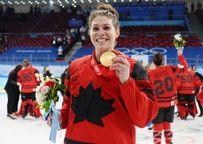 Team Canada's Rebecca Johnston celebrates with the gold medal during the Beijing 2022 Winter Olympics in this Feb. 17 photo.