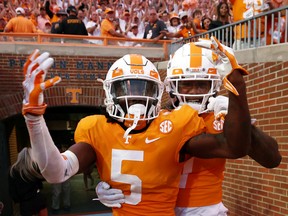 Kamal Hadden #5 and Romello Edwards #7 of the Tennessee Volunteers celebrate after an interception against the Florida Gators at Neyland Stadium on Saturday in Knoxville, Tenn. Tennessee won the game 38-33.