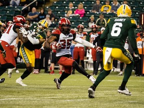 Calgary Stampeders running back Ka’Deem Carey carries the ball past the Edmonton Elks’ defence the last time the rivals met at Commonwealth Stadium in Edmonton, on July 7, 2022. The Stampeders won 49-6.