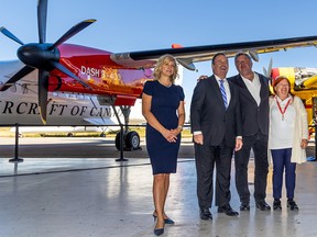 De Havilland Canada owner Sherry Brydson and her husband Rob McDonald, right stand with Alberta Premier Jason Kenney and Wheatland County Reeve Amber Link, left following an announcement that De Havilland is planning on building an airfield and manufacturing complex east of Calgary in Wheatland County. The announcement took place in a De Havilland hanger at the Calgary International Airport on Wednesday, September 21, 2022.