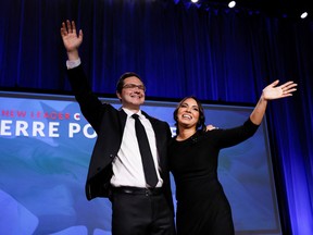 Leadership candidate Pierre Poilievre and wife Anaida Poilievre wave onstage during Canada's Conservative Party leadership election in Ottawa, Ontario, Canada September 10, 2022.