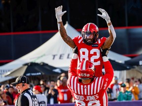 Calgary Stampeders receiver Malik Henry celebrates after his touchdown against the BC Lions with offensive lineman Julian Good-Jones at McMahon Stadium in Calgary on Aug. 17, 2022.