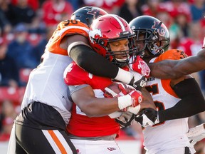 Calgary Stampeders Peyton Logan is tackled by Mathieu Betts of the BC Lions during CFL football in Calgary on Saturday, September 17, 2022.