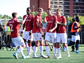 Cavalry FC players celebrate during their 1-0 victory over FC Edmonton at Clarke Field in Edmonton on Saturday, Sept. 17, 2022.