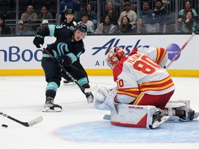 Calgary Flames goalie Dan Vladar holds the fort during Tuesday night's preseason game against the Kraken in Seattle. The Flames lost 3-0.