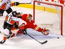 Calgary Flames goalie Jacob Markstrom stops Anaheim Ducks Sonny Milano in first period NHL action at the Scotiabank Saddledome in Calgary on Wednesday, February 16, 2022.