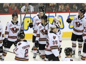 The Calgary Hitmen salute their fans after the third period of action as the Calgary Hitmen lost to the visiting Lethbridge Hurricanes 3-2 in overtime at the Saddledome for their last game of the season. April 17, 2022. Brendan Miller/Postmedia